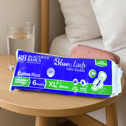 Wukusy Beautiful Basics Blue Lady Sanitary Pads XL 280mm, 6-pack, showing absorbent surface and packaging for health care use.