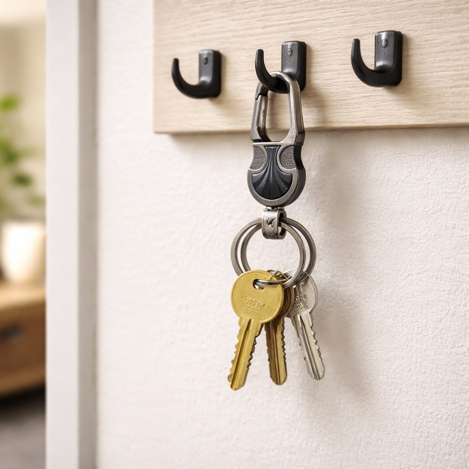 Premium metal key holder keychain by Wukusy with a sleek silver finish and multiple key rings for organizing keys.