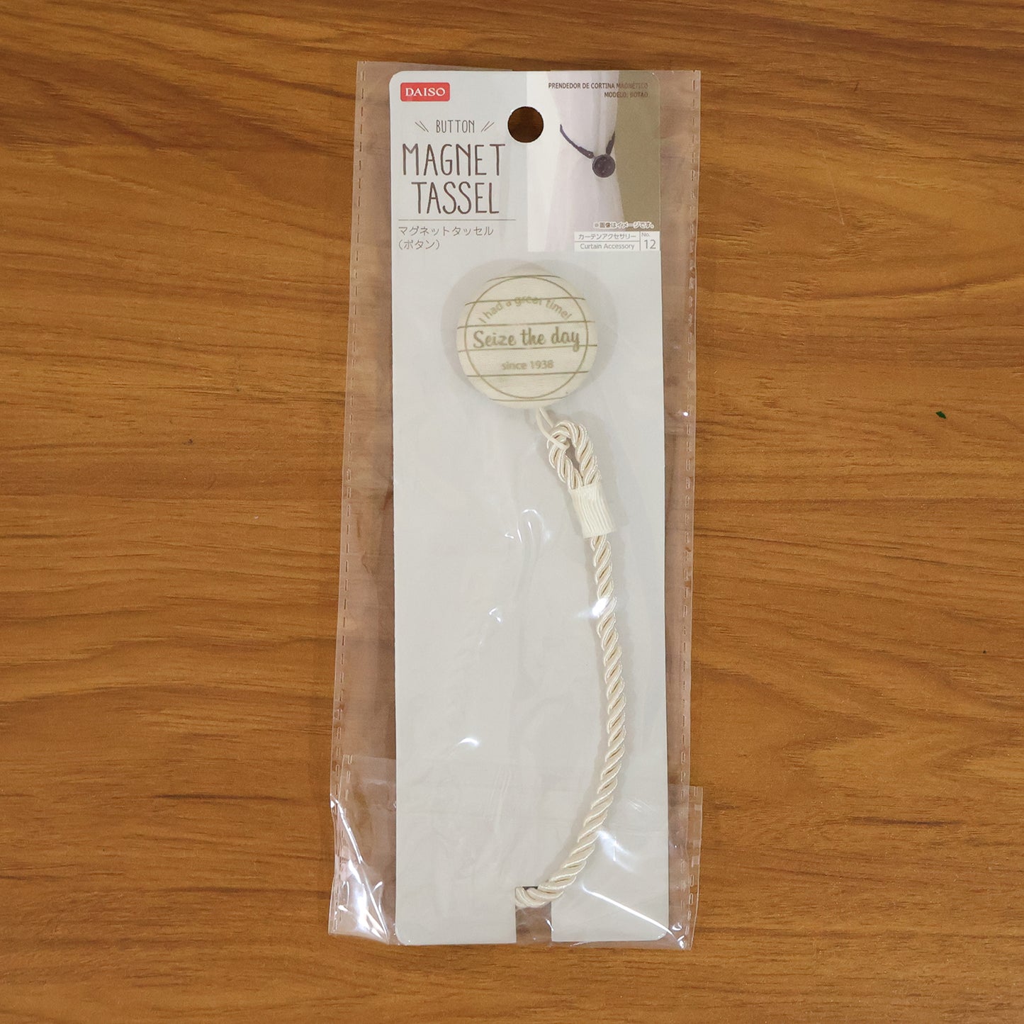 Elegant magnetic curtain tieback by Wukusy holding a beige curtain, showcasing its sleek design and secure magnetic closure.