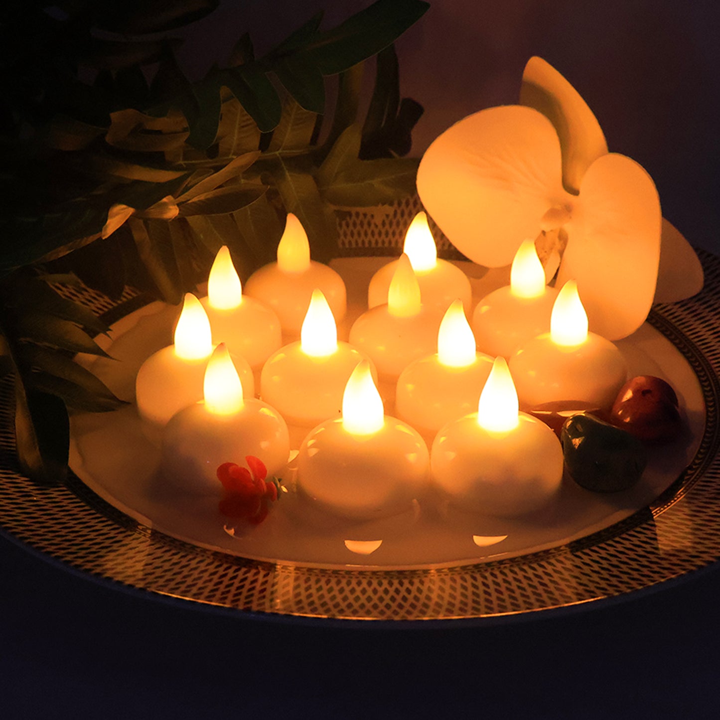 Set of 12 LED floating smokeless candles from Wukusy for home decor, featuring warm light and realistic flickering effect.