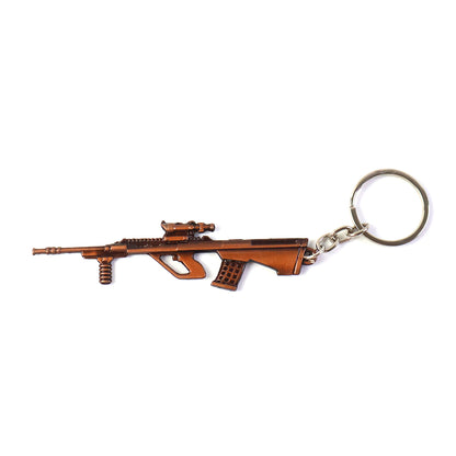 Wukusy metal gun shape keychain with detailed design, attached to a keyring, showcasing a sleek, firearm-inspired accessory.
