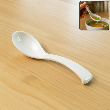 White plastic soup spoon with deep bowl from Wukusy, ideal for serving soups and liquids in home and kitchen settings.