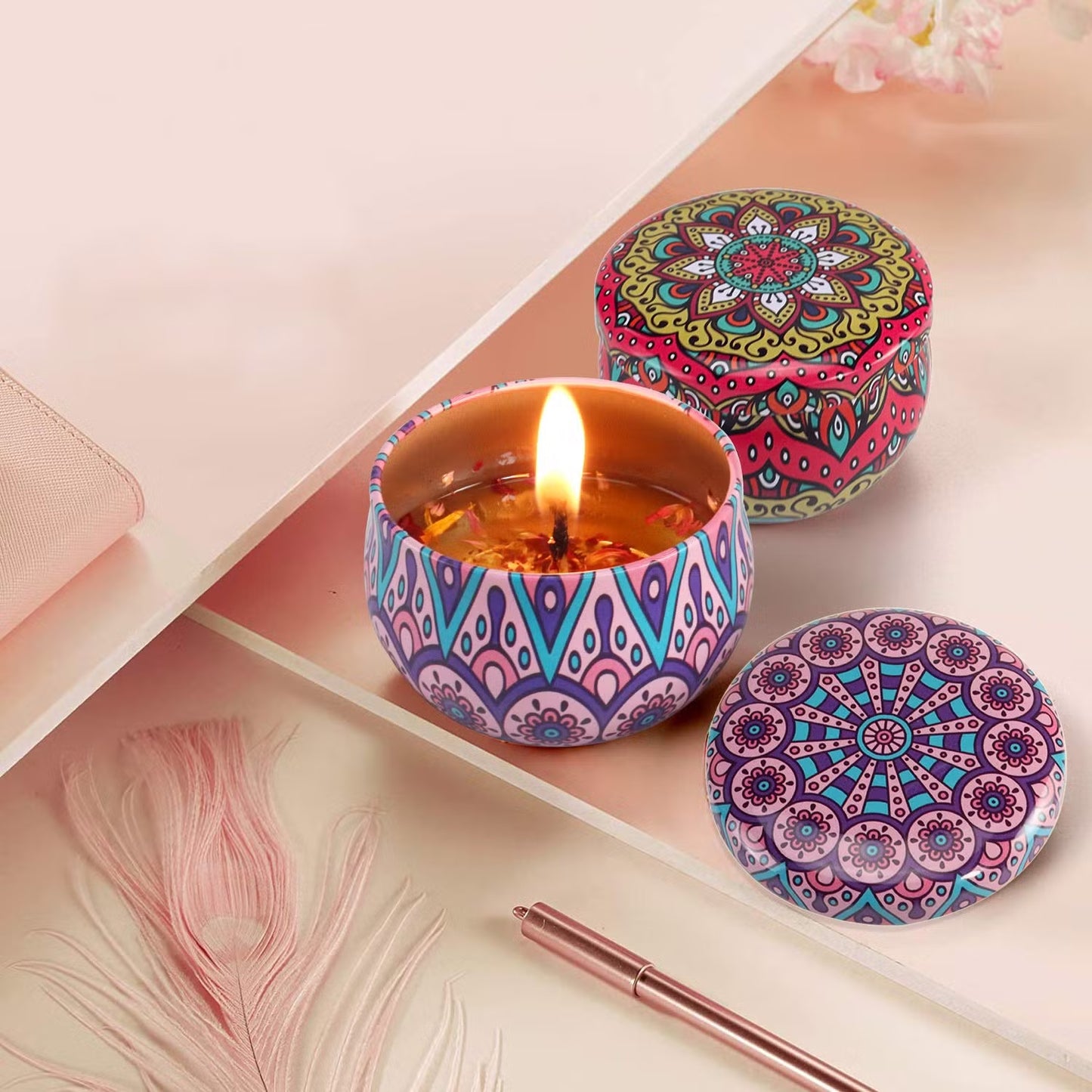 Set of four Wukusy decorative metal candle containers with intricate mandala prints for stylish home decor.