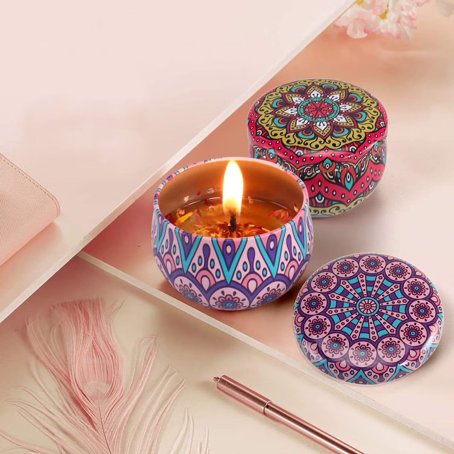 Set of four Wukusy decorative metal candle containers with intricate mandala prints for stylish home decor.