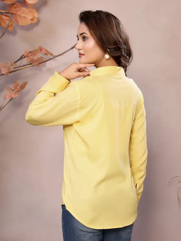 Golden pure viscose women's shirt with a collared neck, hip length, and half sleeves by Ekom, shown in the image.