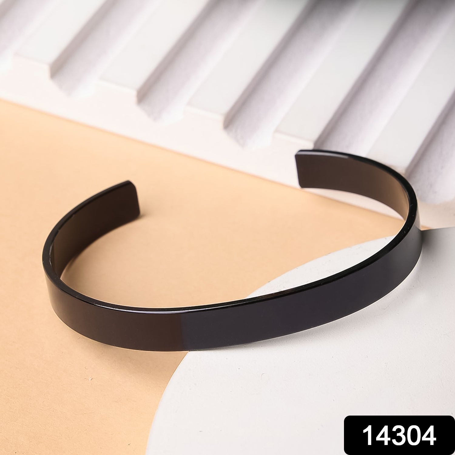 Black-plated stainless steel Kada bracelet by Wukusy, stylish fashion accessory with sleek design and polished finish.