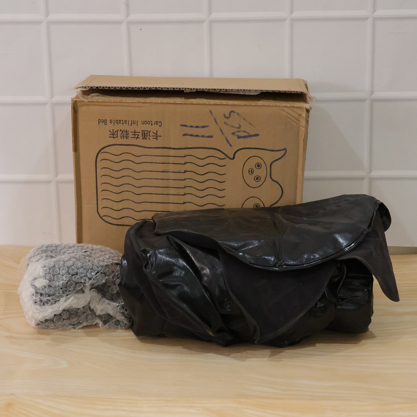 Wukusy cute car air mattress set with black cat pillow for comfortable on-the-go sleeping, shown inflated inside a vehicle.