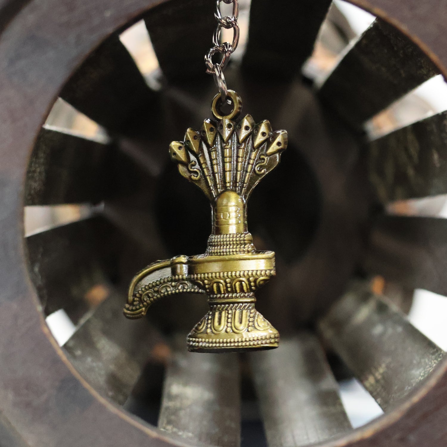 Antique Lord Shiva Shivaling metal keychain from Wukusy, featuring detailed Shivaling design on a small, decorative keychain.