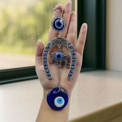Decorative evil eye wind chime with elephant and horseshoe motifs, hanging ornament by Wukusy, featuring colorful beads and charms