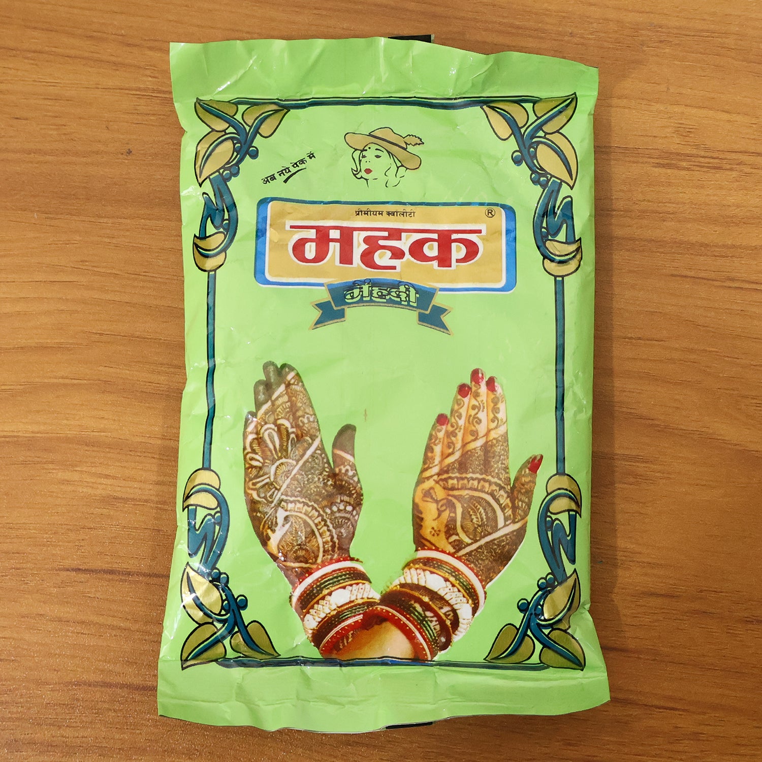 Wukusy traditional herbal mehndi powder in an 80 gram pack, showing fine greenish henna powder in a clear container.