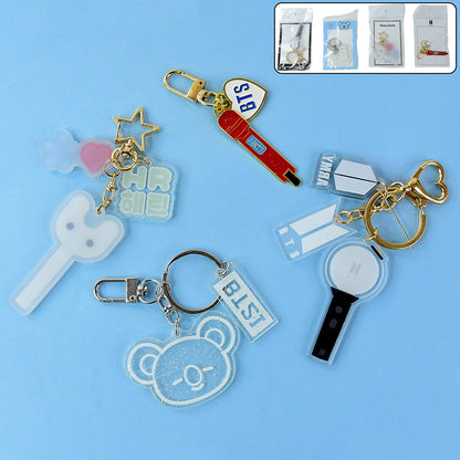 Cute Wukusy acrylic and metal keychain with mixed designs, featuring colorful and playful accessories on a keyring.