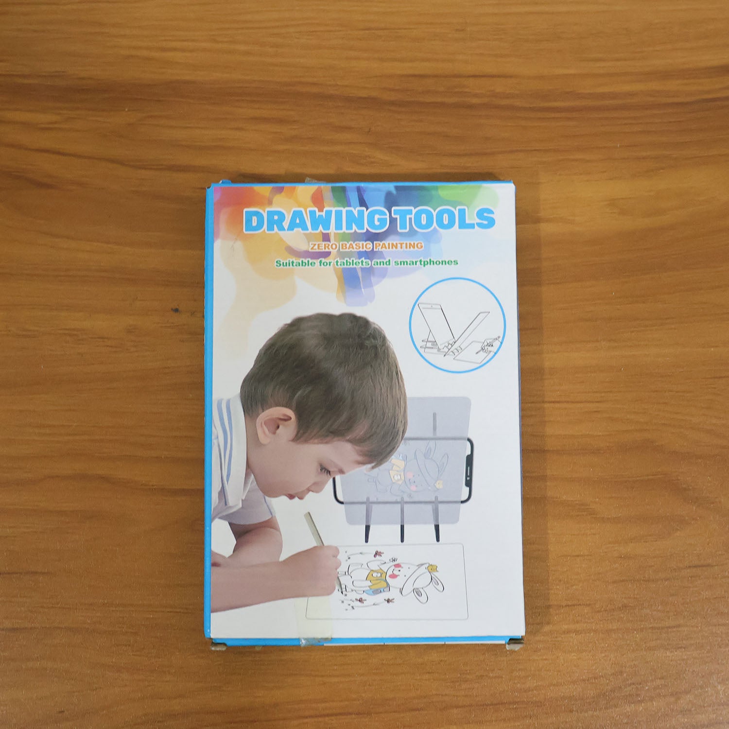 Wukusy smart mobile phone screen drawing projector board kit showing a compact device with projection lens and control buttons.