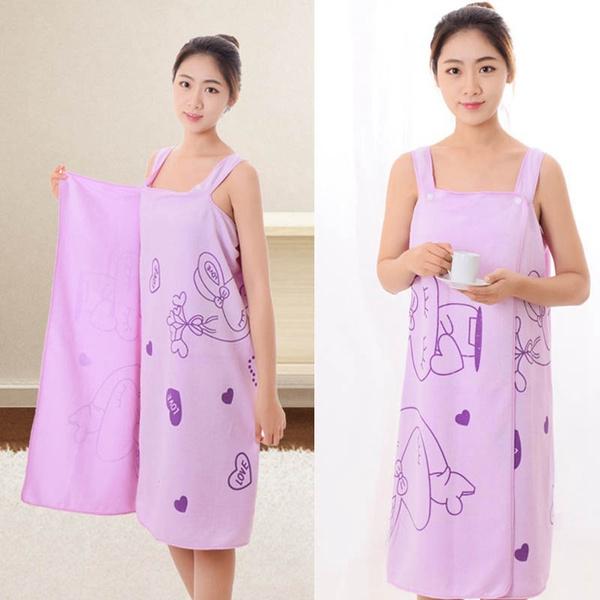 Wukusy 1453 quick dry bath towel made of 100% cotton, soft, fluffy, and highly absorbent for men and women in a health and beauty setting.