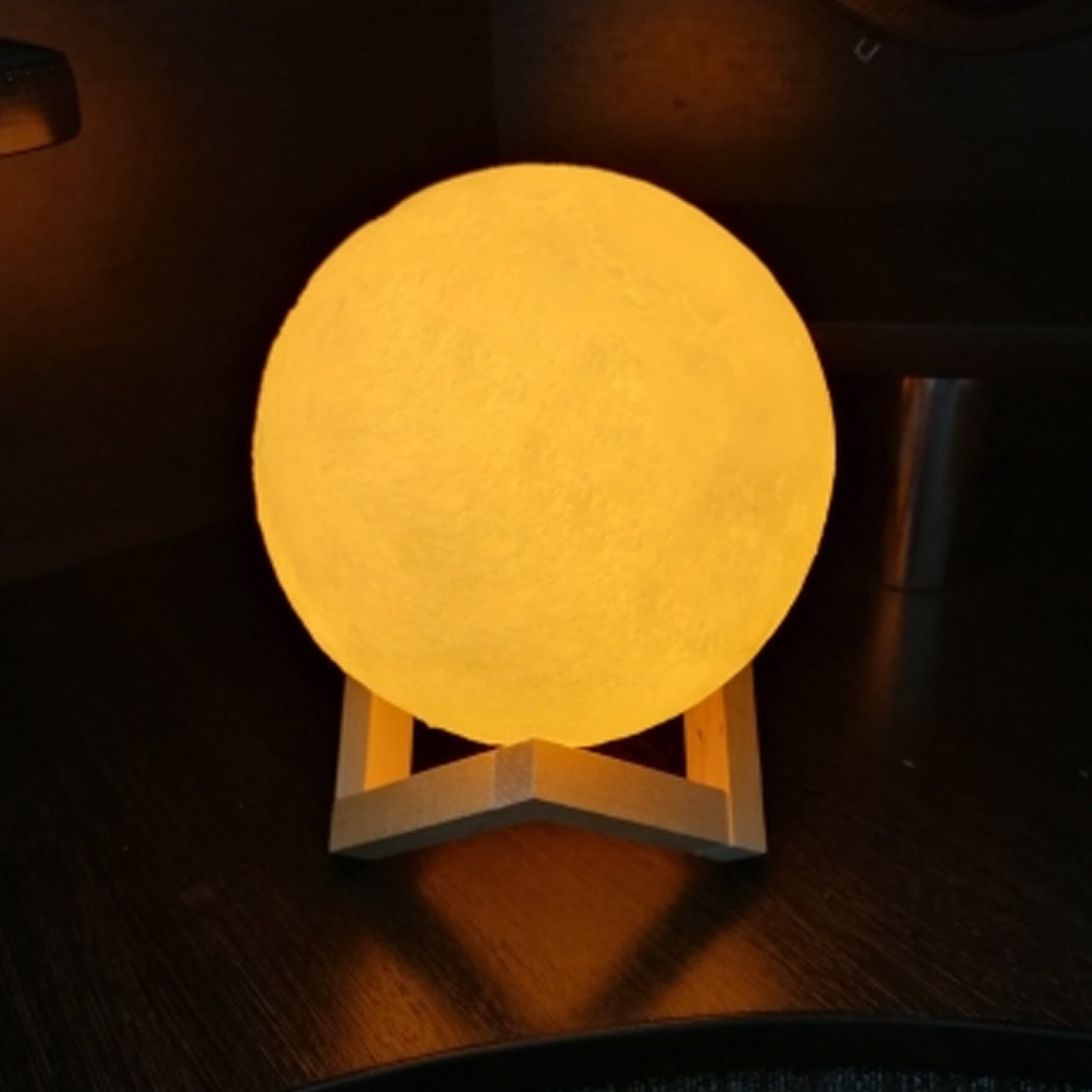 Wukusy 6031 3D Power Moon Lamp with touch control, showing a glowing moon lamp with adjustable brightness and realistic lunar surface.