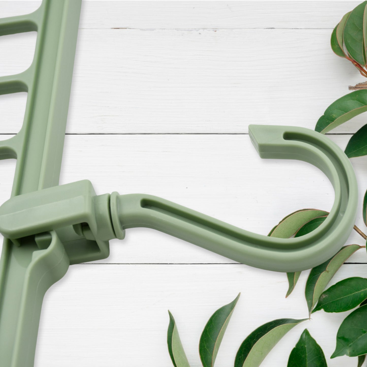 Wukusy plastic hanging hook on a wardrobe rod, used for organizing clothes and storage in indoor closets or balcony spaces.