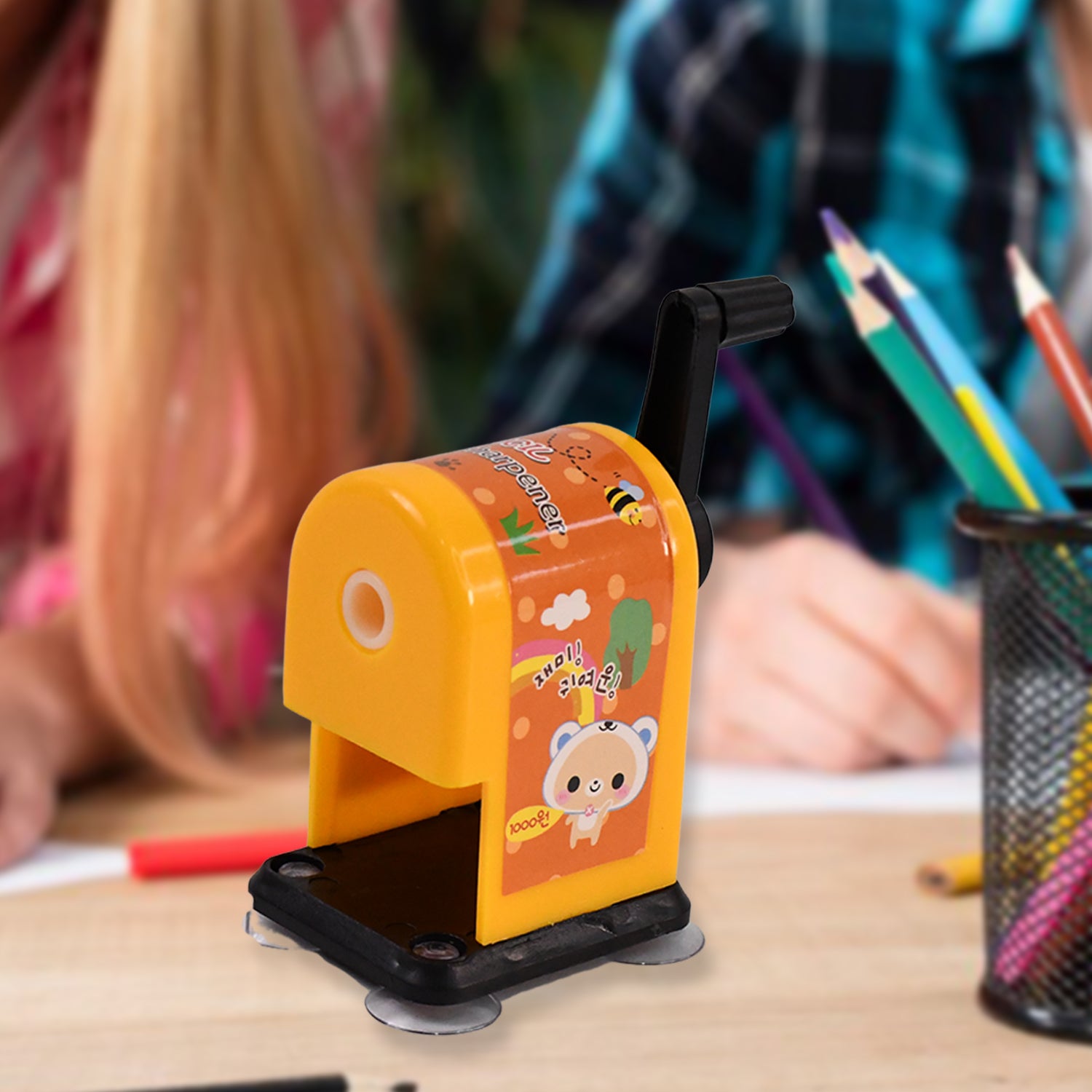 Wukusy office table pencil sharpener in black with metal blade, compact design, perfect for sharpening pencils on desks.
