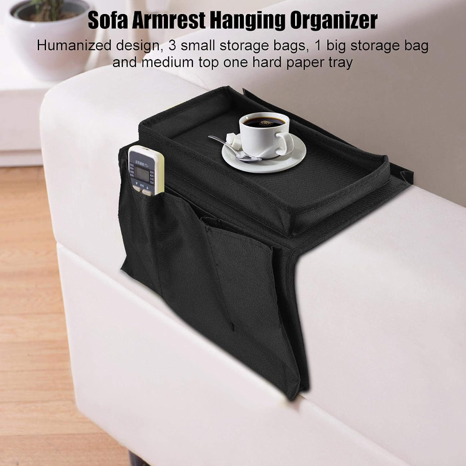 Black Wukusy sofa arm rest hanging storage bag with multiple compartments for magazines, tablets, and books.