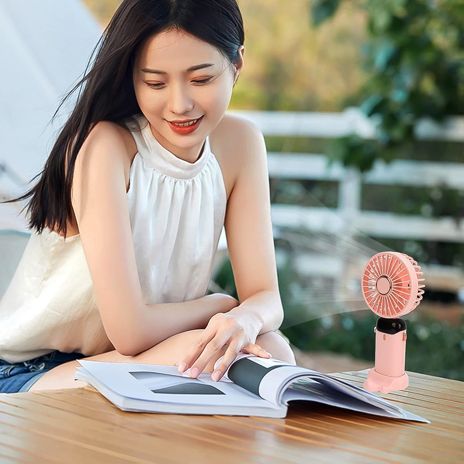 Wukusy rechargeable portable handheld fan with adjustable blades, compact design, and ergonomic handle for easy use.
