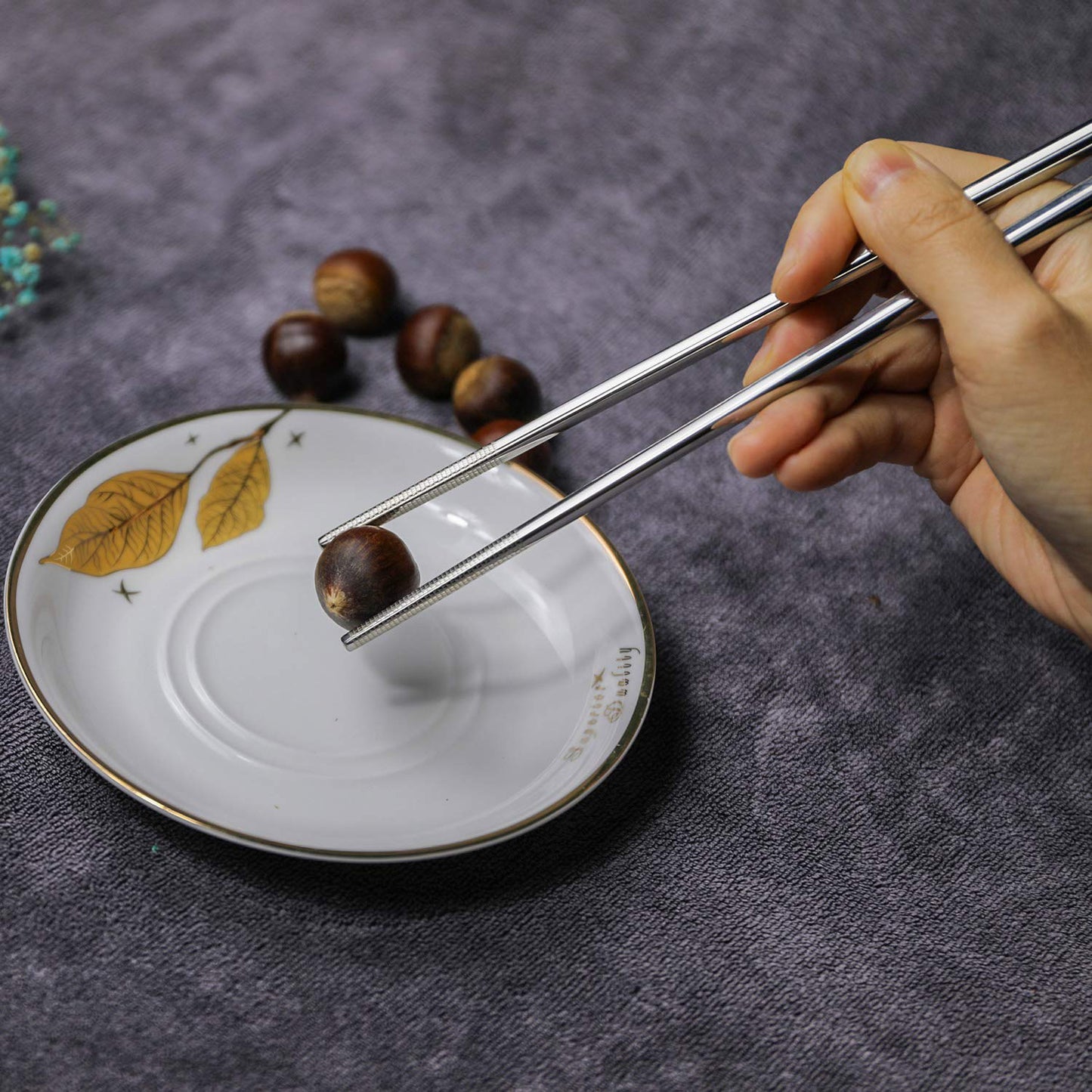 Pair of Wukusy premium stainless steel reusable chopsticks for home and kitchen use, sleek and durable for everyday dining.