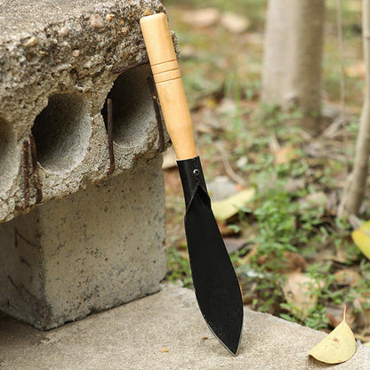 Wukusy heavy duty gardening trowel with wooden handle, ideal for planting and digging in garden beds.