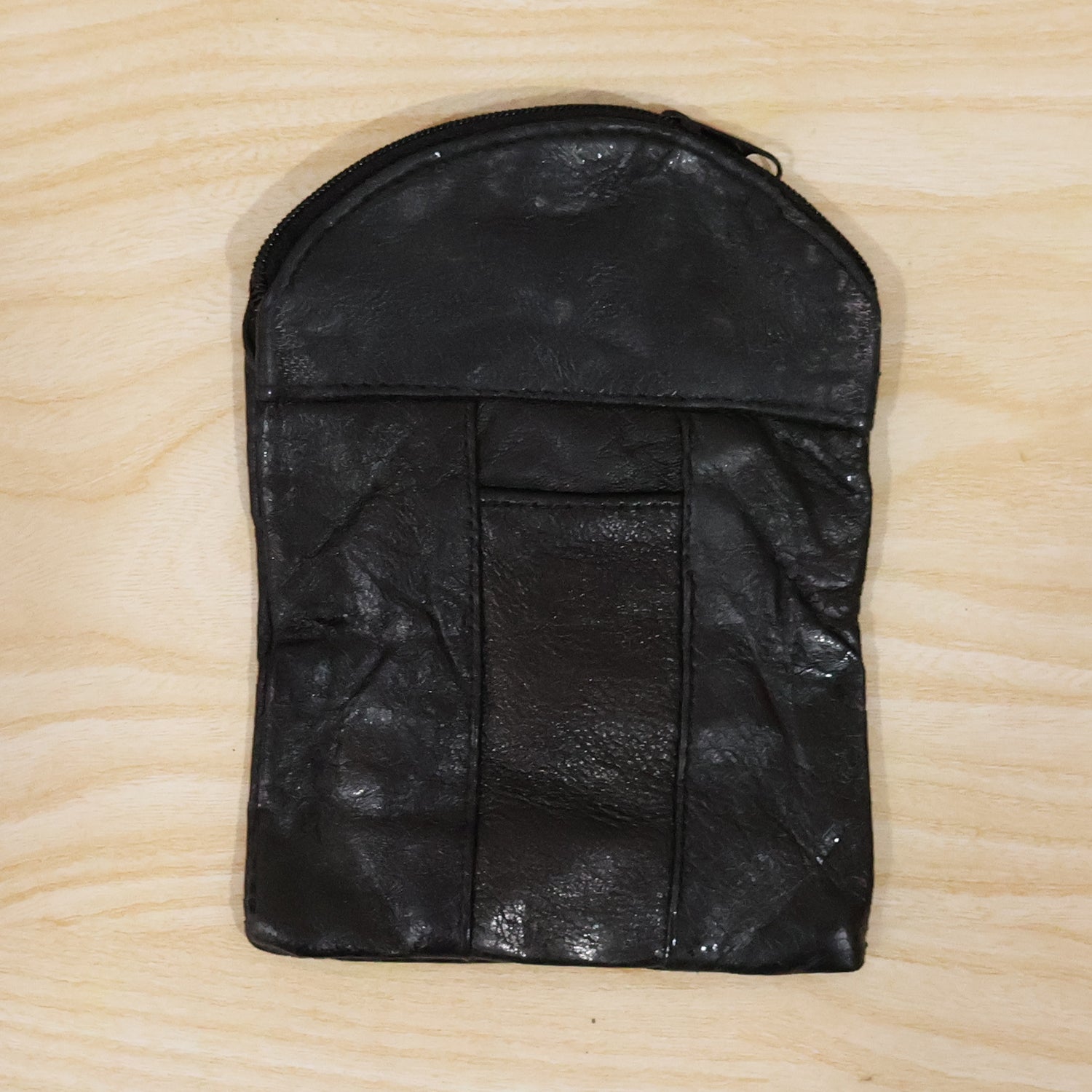 Leather mini zipper pouch by Wukusy, compact coin and card organizer for men and women, with a sleek, stylish design.