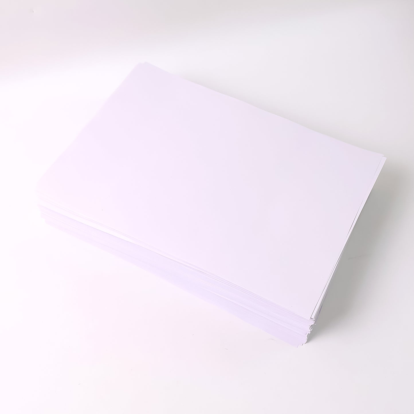 A4 size Wukusy multipurpose copier paper stack with 500 sheets, high brightness white printing paper for office use.