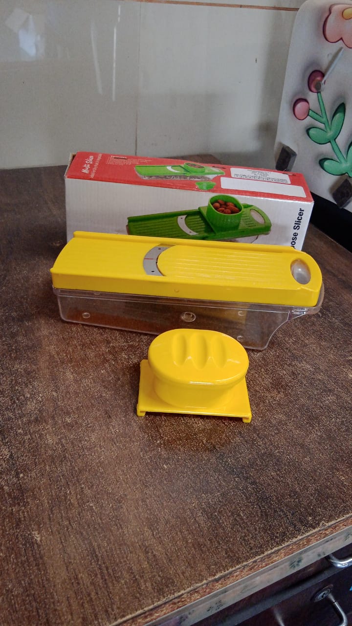 Wukusy yellow multi-purpose vegetable and fruit slicer with sharp blades for efficient slicing and dicing.