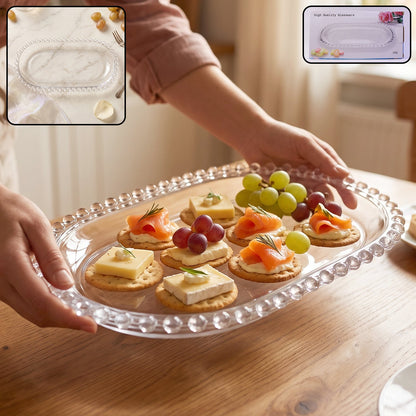 Clear glass oval serving tray with beaded edge, 9 inches, perfect for snacks, by Wukusy.