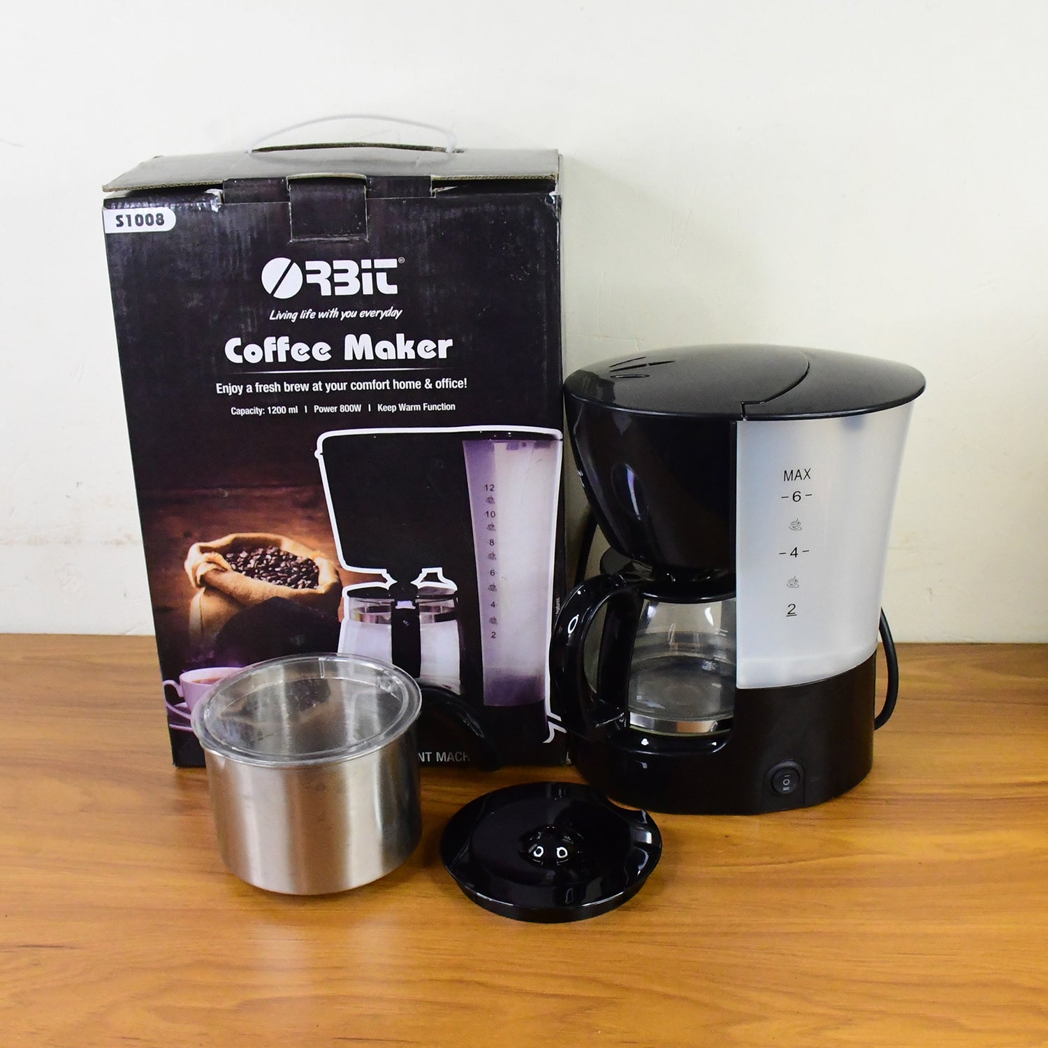 Wukusy Orbit automatic drip coffee maker with 800w power and 1200ml capacity, shown on a kitchen countertop.