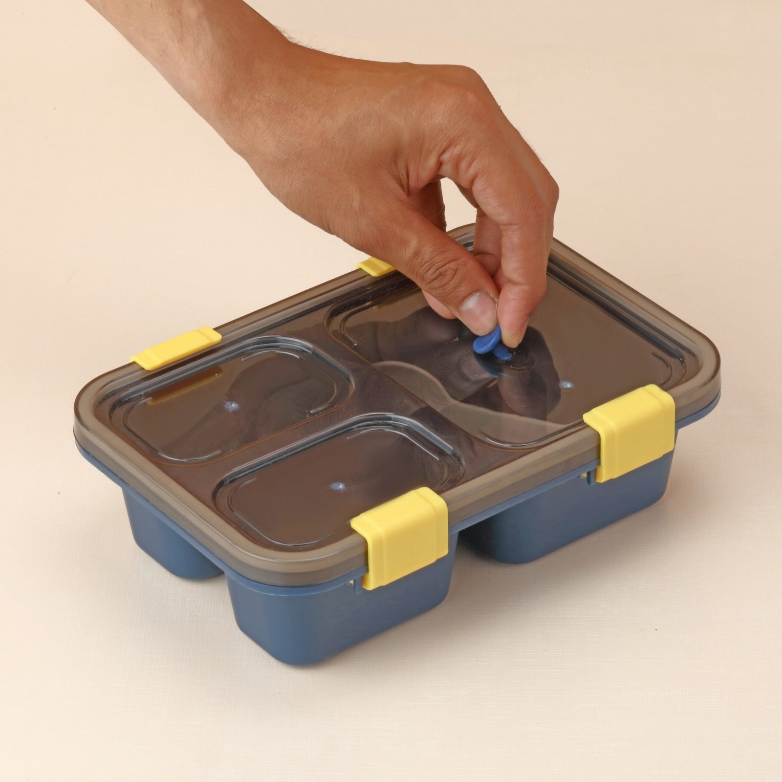 Wukusy 5627 plastic kids' lunch box with three compartments, insulated tiffin box for boys, girls, school, and office use.