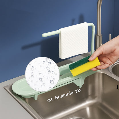 Plastic telescopic sink storage rack by Wukusy, adjustable to fit various sink sizes with multiple compartments for organization.