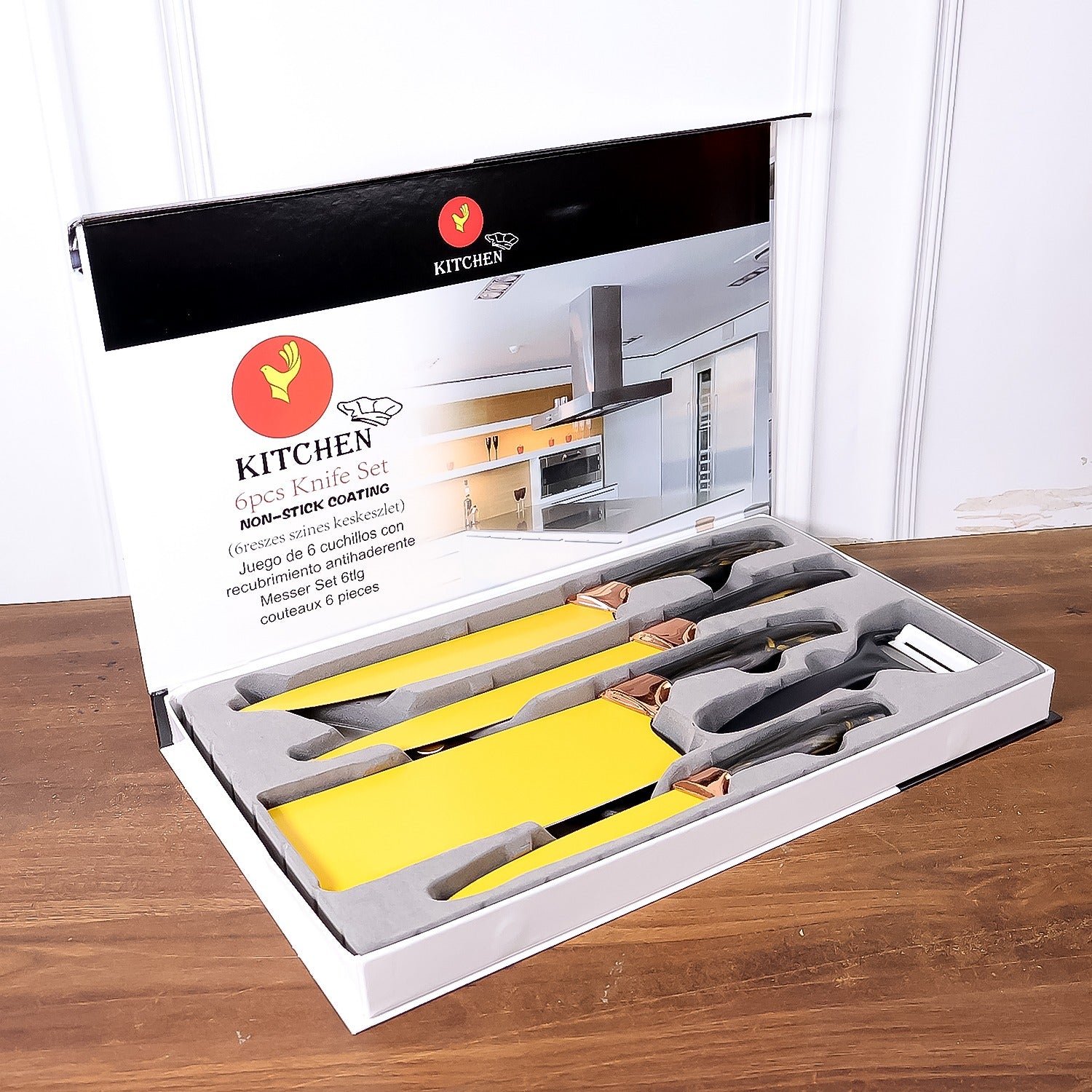 Six-piece Wukusy professional kitchen knife set including chef knives, cleaver, peeler, and scissors on a countertop.