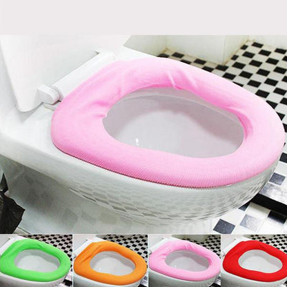 Wukusy 4768 bathroom soft, thicker, stretchable washable toilet seat cover pad on a white toilet seat in a bathroom setting.