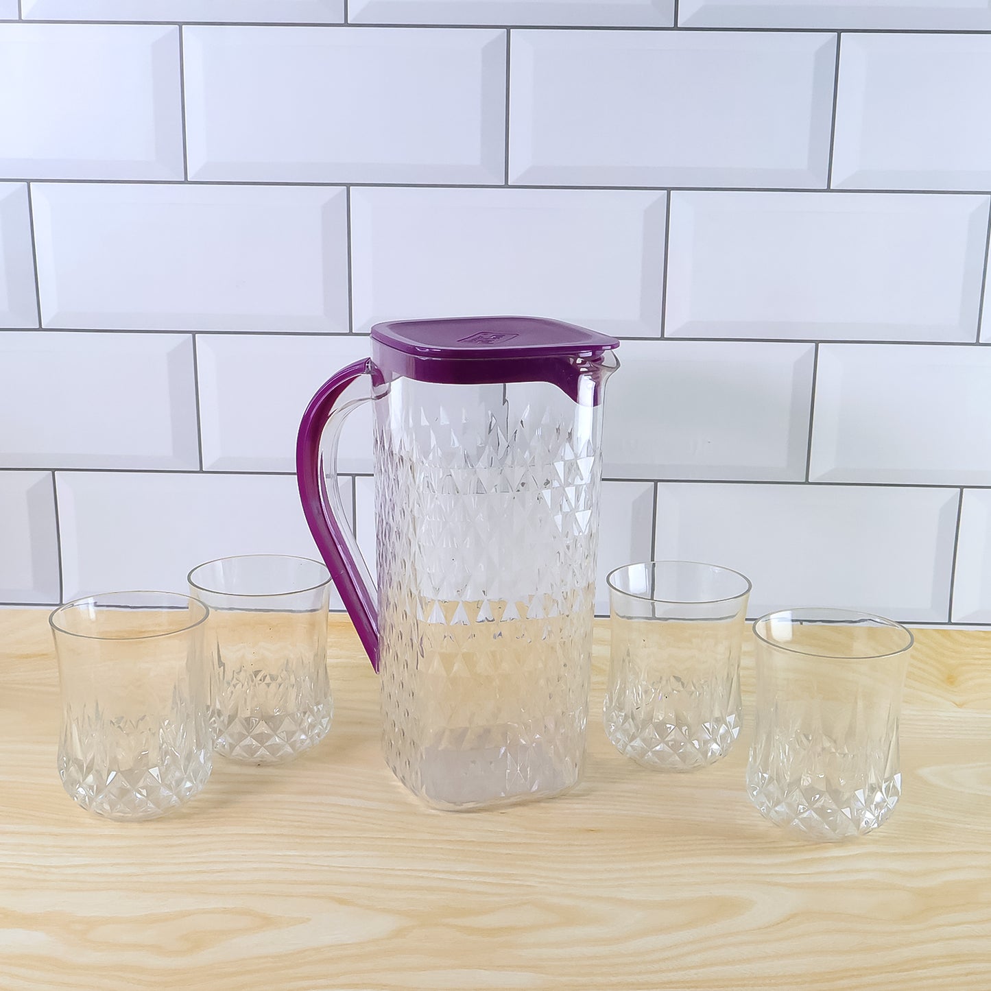 Wukusy Supermom Roma plastic jug with four matching glasses in a 5-piece home and kitchen combo set displayed on a table.