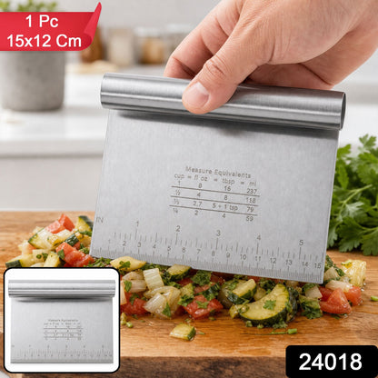 Small Wukusy stainless steel dough scraper cutter with scale, measuring 15x12 cm, shown on a bakery surface with dough.