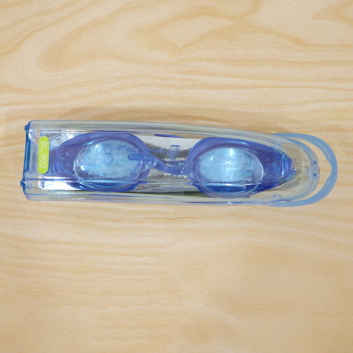 Kids professional swimming goggles by Wukusy with anti-fog lenses, shown in a close-up image of the goggles on a white background.