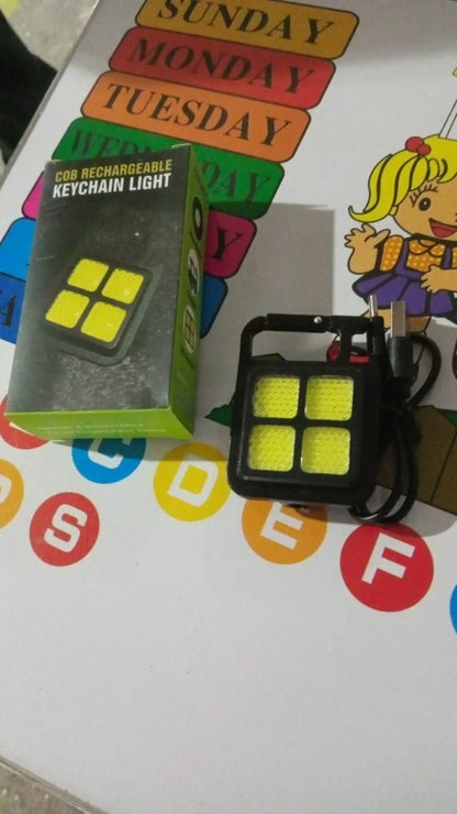 Wukusy 4 LED mini keychain light showing compact design with keyring attachment, ideal for home improvement and portable lighting.