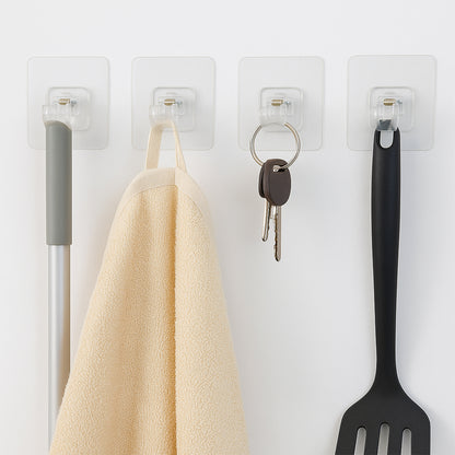 Transparent self-adhesive wall hook holder clip by Wukusy, showing the clear hook attached to a wall surface.