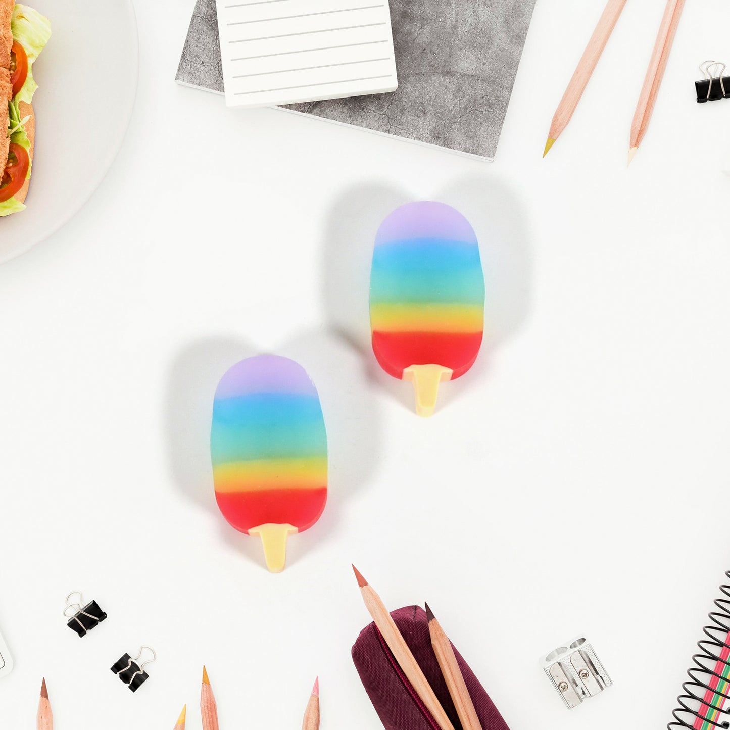Two Wukusy Jelly Popsicle shape mini erasers in bright colors, creative and cute office and school supplies for children.