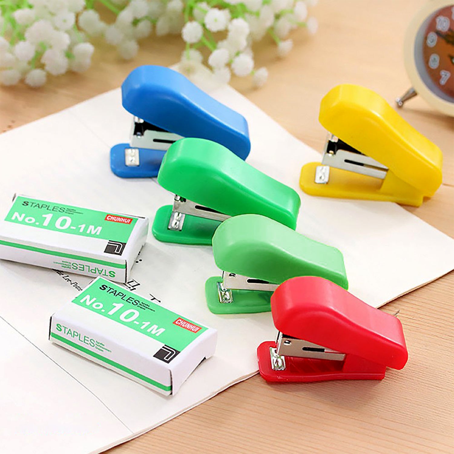 Assorted color Wukusy Mini Stapler Set with 20 No.10 staplers and pins, compact and portable for office or home use.