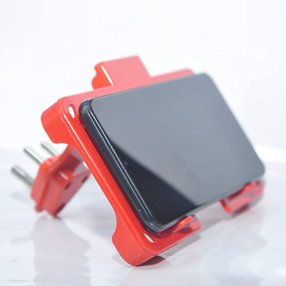 Red Wukusy multi-purpose wall holder stand for mobile charging, fits in socket, with space to hang phones or accessories.