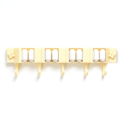 Wukusy self-adhesive wall-mount broom and mop holder rack attached to a wall in a home improvement setting.