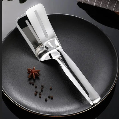 Ekom stainless steel multifunction cooking serving turner and food tongs for frying, grilling, and serving in kitchen and BBQ settings.