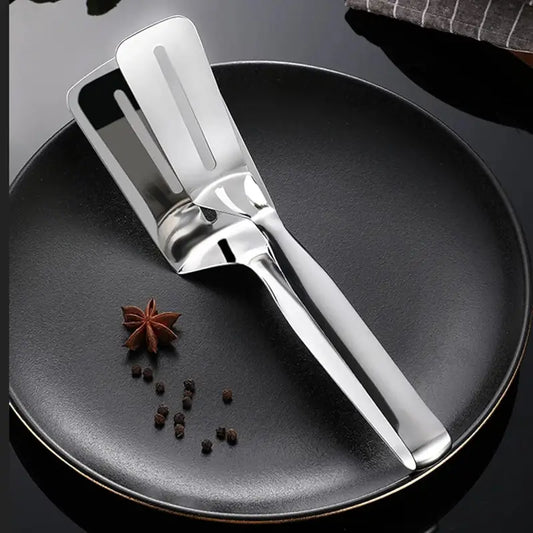 Ekom stainless steel multifunction cooking serving turner and food tongs for frying, grilling, and serving in kitchen and BBQ settings.