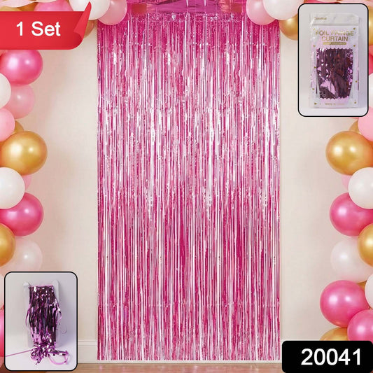 Shiny gold foil fringe curtain for birthday party decoration, featuring long metallic strips hanging vertically.