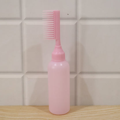 Wukusy 2-in-1 hair oil applicator bottle with scalp comb for root care, shown with transparent bottle and integrated comb attachment