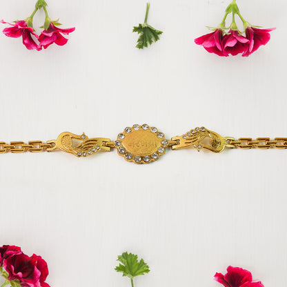 Wukusy Rakhi bracelet with stone border and dual peacock chain ends, featuring intricate design and vibrant craftsmanship.