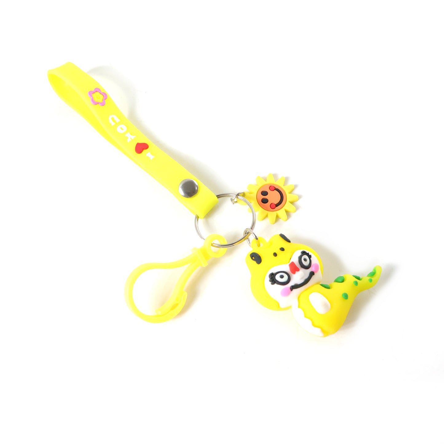 Cute cartoon dinosaur keychain with strap and decorative charm, featuring vibrant colors and detailed dino design.