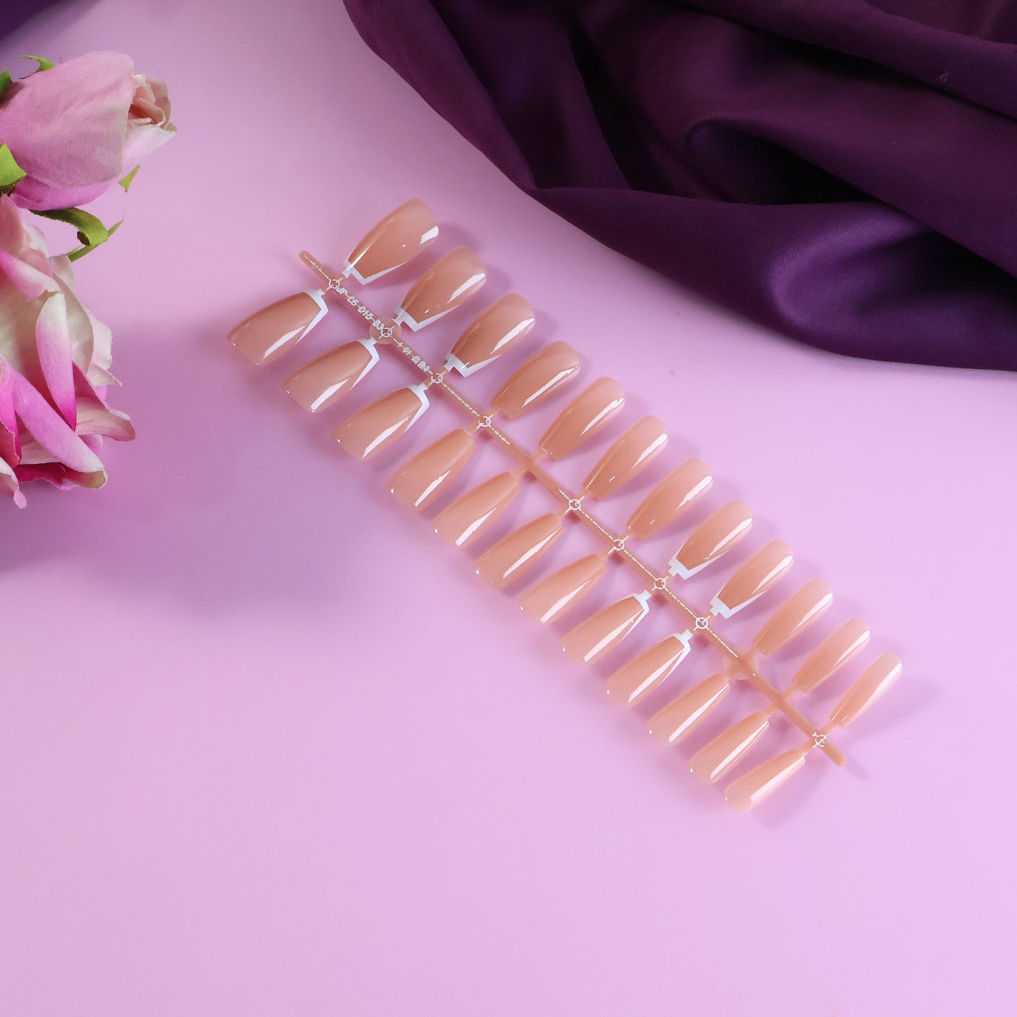Wukusy elegant nude glossy artificial nail tips in a 24-piece set, showcasing smooth, shiny fake nails for a stylish look.