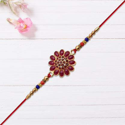 Red floral stone rakhi with bead accents, Wukusy fashion bracelet featuring vibrant floral design and decorative beads.